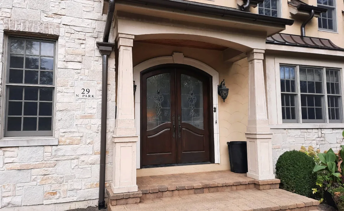 Home 34 Stone entryway with copper downspouts