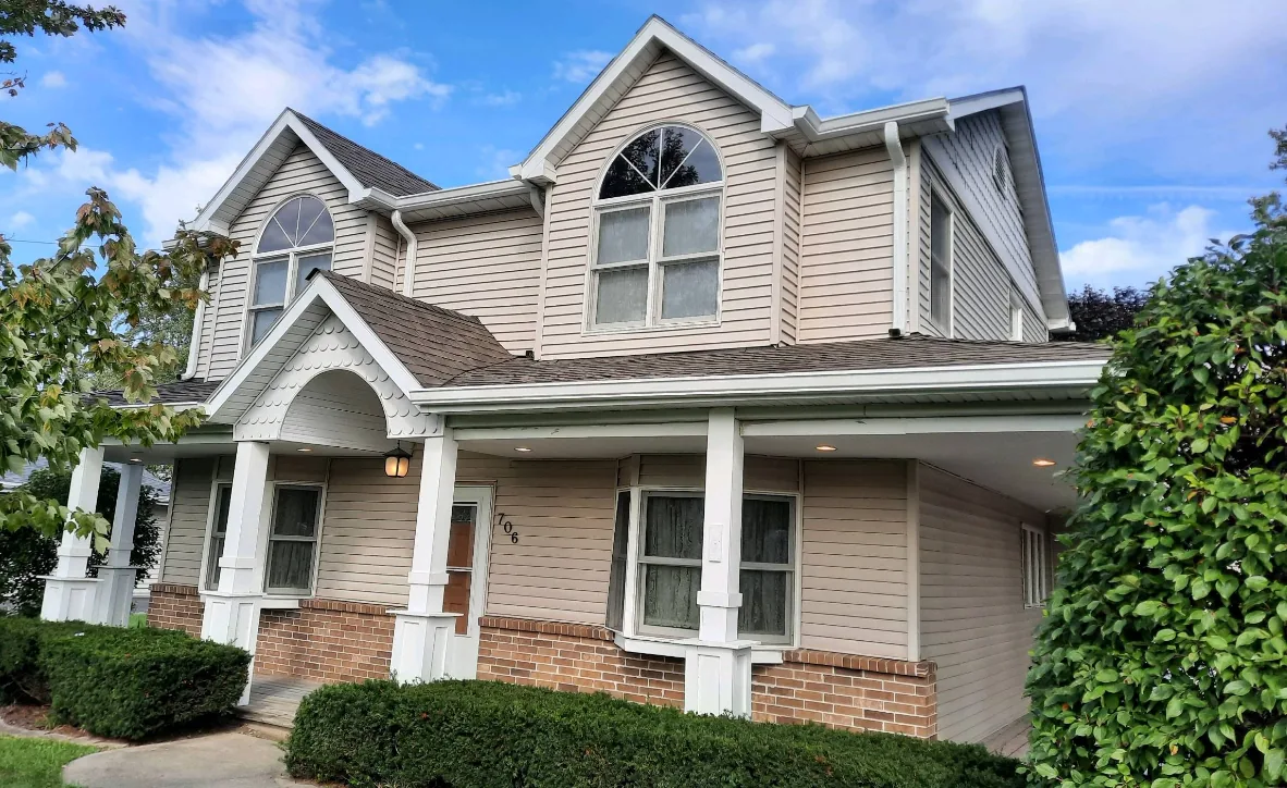 Home 35 Two-story vinyl siding home with seamless gutters