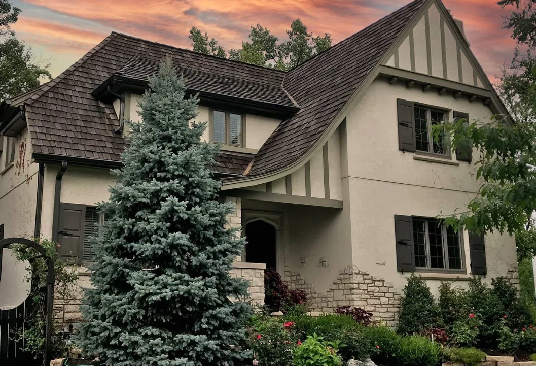 Home 37 Tudor style stucco home at sunset