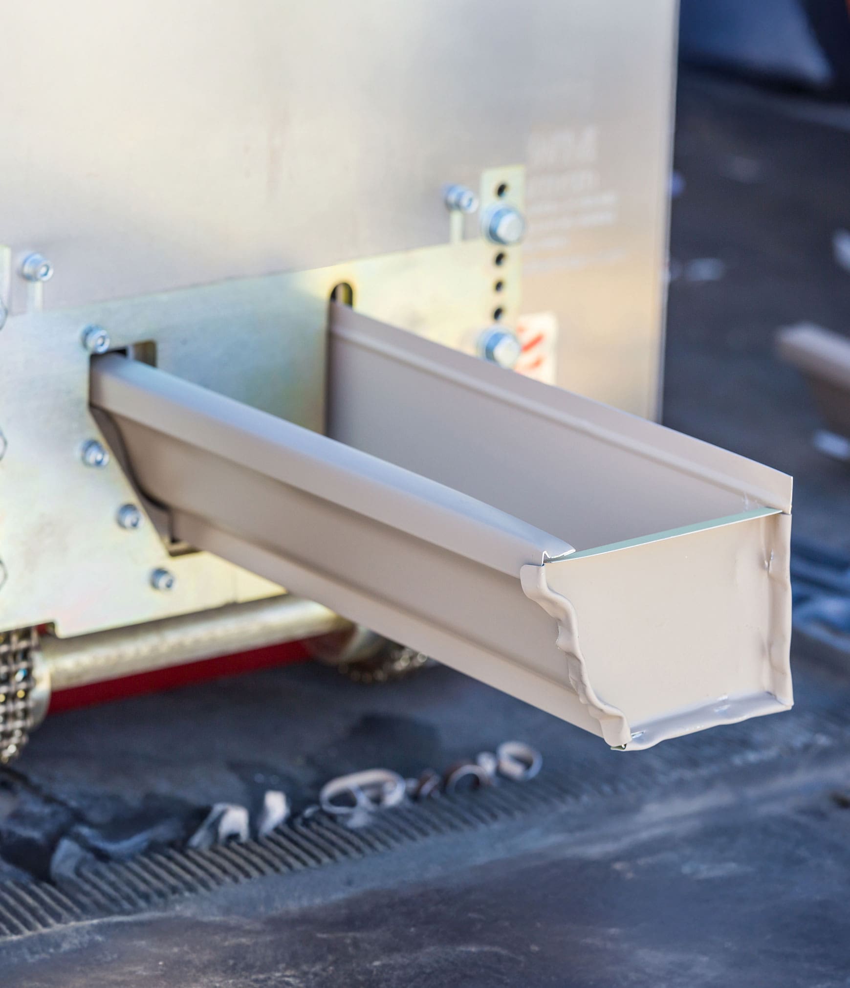 Seamless gutter emerging from the on site forming machine